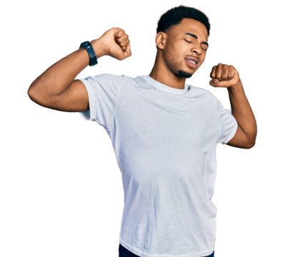 Young african american man wearing casual white t shirt stretching back, tired and relaxed, sleepy and yawning for early morning