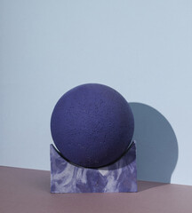 Minimalistic scene with geometric shapes on two tone background with shadow.