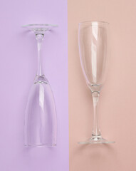 Empty Champagne glasses on a pastel background. Top view