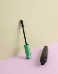 Creative beauty layout with mascara brush on pastel background. Conceptual pop. Minimal still life