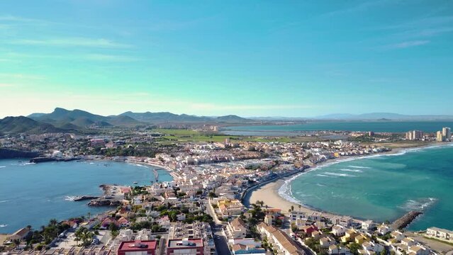 Aerial drone point of view of Palos Cape. Situated in Cartagena, Murcia, Spain. Famous turist destination in Mar Menor. Luxury urbanisations, sandy beaches, famous travel destination. Drone forward
