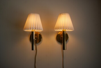 lamp on the wall with white shades.