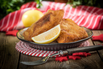 Fried cod slices in breadcrumbs.