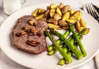 bone less steak top with mushrooms  served with asparagus