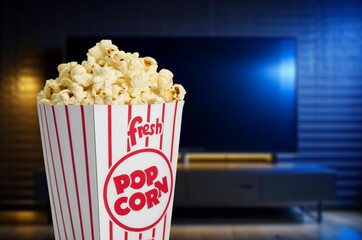 TV screen and popcorn bowl on desk