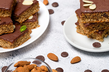 Chocolate almond dough. Traditional chocolate dough decorated with almond flakes