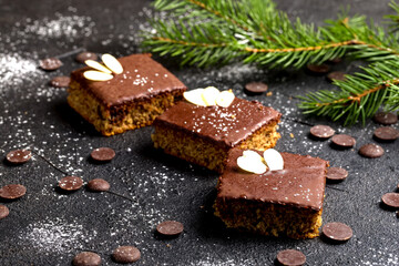 Chocolate almond dough. Traditional Christmas chocolate dough decorated with almond flakes