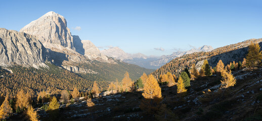 Panoramic view on beautiful alpine valley full of golden larches during autumn, Dolomites, Italy