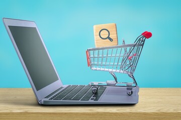 Shopping cart with cube of Magnifying icon