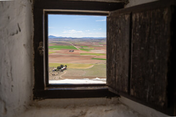 Landscape of cereal fields of Castilla la Mancha seen through a small square window