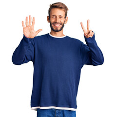 Handsome blond man with beard wearing casual sweater showing and pointing up with fingers number seven while smiling confident and happy.
