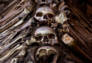 Human skulls with bones on the sides creating a macabre design of The Chapel of Bones located in...