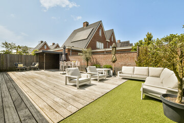 Outdoor seating furniture in patio by contemporary house