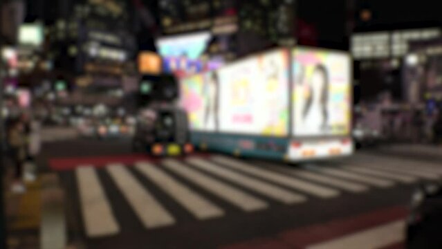 SHIBUYA, TOKYO, JAPAN - NOVEMBER 2023 : View of billboard truck at the street. Also known as advertising car. Blurred video.