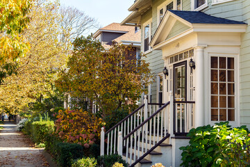 Glass-enclosed front entry of a house in an autumn day, Boston, MA, USA 