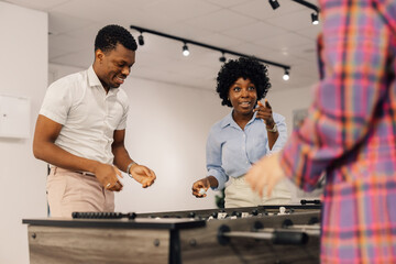 Portrait of a two african american colleagues while playing table football