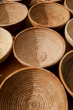 Closeup of round wooden bowls in bakery