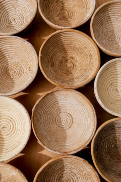 Closeup of round wooden bowls in bakery