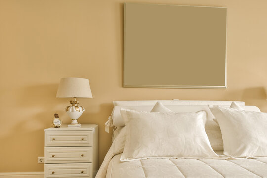 Bedroom with bed and frame on wall