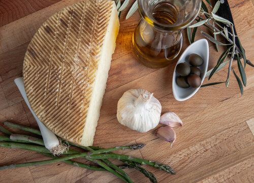 Artisan cheese with olive oil and fresh ingredients