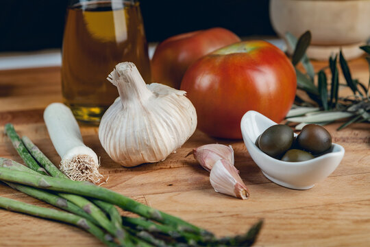 Fresh Mediterranean cooking ingredients on wood
