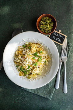 Healthy homemade pesto Farfalle pasta on dark background