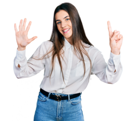 Young brunette teenager wearing business white shirt showing and pointing up with fingers number six while smiling confident and happy.