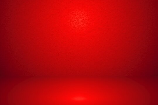 Abstract red gradient background for product placement or website.  Empty room with copy space and spotlight for product presentation
