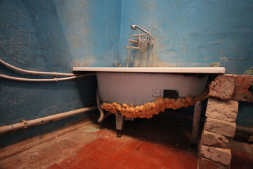 Old vintage dirty broken bathroom. Trash repairs. Grunge background.