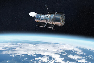 The Hubble space telescope on orbit of Earth planet. Space observatory research. Elements of this...