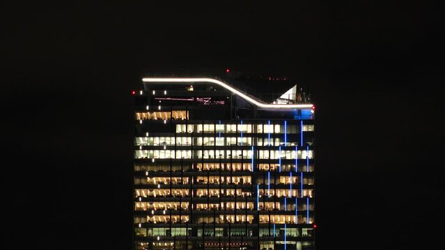 SHIBUYA, TOKYO, JAPAN - NOV 2023 : Close up shot of Shibuya sky building at night. A large complex facility has 47 floors above the ground, 229m high. Japanese urban city and technology concept video.