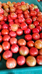 Close-up of tomatoes stacked for market sale 