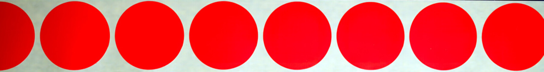 Red Coloured Round Stickers. Blank red round adhesive paper sticker label set collection isolated