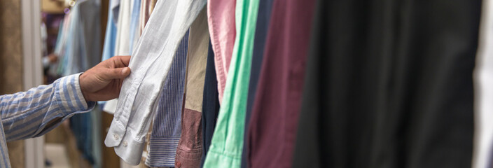 Young beautiful man shopping in fashion mall