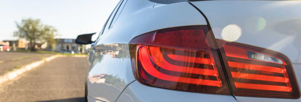 Red tail lights of white cars