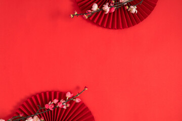 Happy Chinese New Year. Chinese New Year banner with blooming flowers, asian paper fans on red...