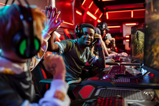 Professional gamers high fiving during tournament