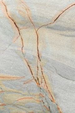 Detailed beige marble texture with orange veining