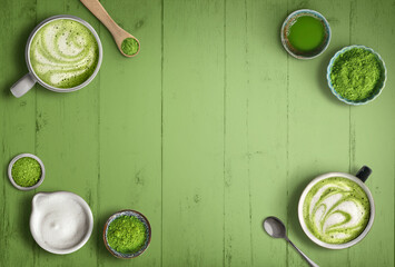 Matcha latte and green tea powder ingredients on white wood background with copy space