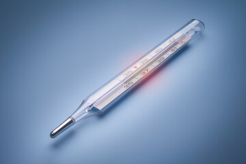 mercury thermometer on a blue background