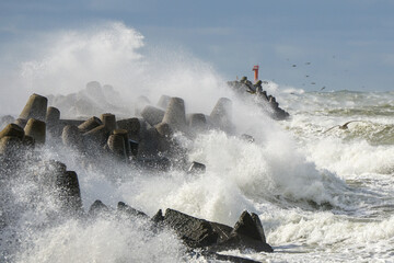 Big wave breaking on breakwater on Liepaja harbor