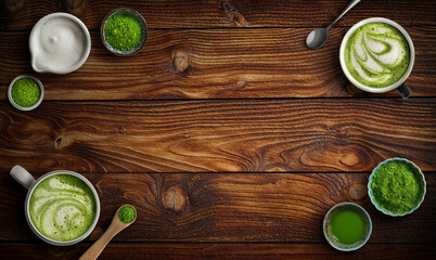 Matcha latte and green tea powder ingredients on rich wood background with copy space