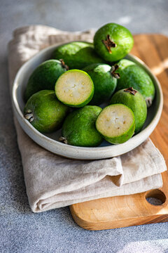 Fresh Feijoa Fruits in a Bowl on Wooden Board