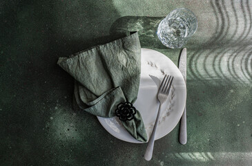Elegant Table Setting with Shadow Play and Reflections