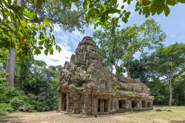 Ancient Khmer temple ruins in lush Cambodian forest