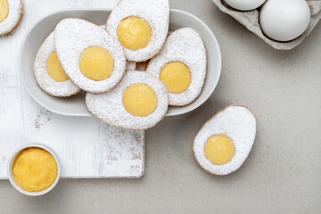 Easter eggs biscuits with lemon curd yolks top view