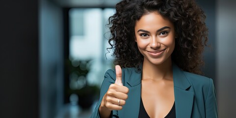 young woman showing thumbs up sign over blue background - obrazy, fototapety, plakaty