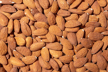 Scattered Almonds. Background from Almond Nuts. Natural High-Calorie Snacks