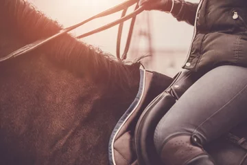 Foto op Plexiglas Atmospheric photo of a horse rider. Horse riding school. Equestrian theme. © peterzayda