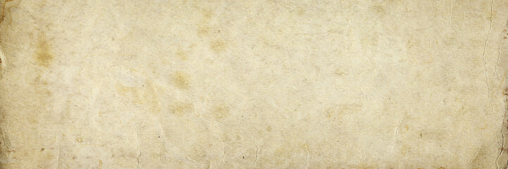 Obraz premium Old paper texture. Rough faded surface. Blank retro page. Empty place for text. Panoramic background for vintage style design.